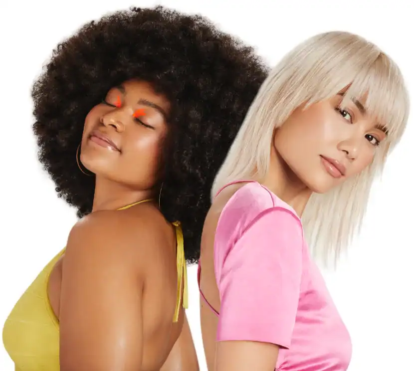 Two women posing with stylish hairstyles and outfits